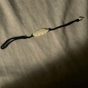 NWOT wanderer bracelet ivory feather with button closure